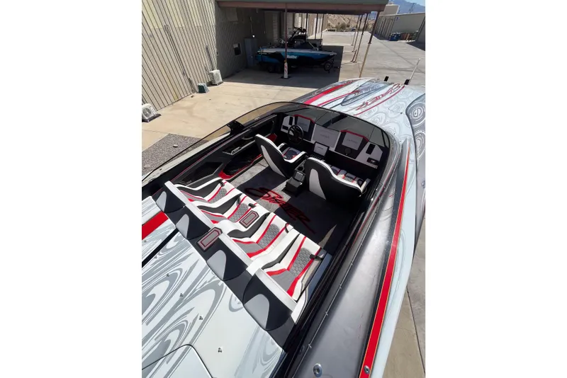 Slide: The Image of 2009 Skater 388 powerboat with sleek design and modern interior, docked outdoors. - 13