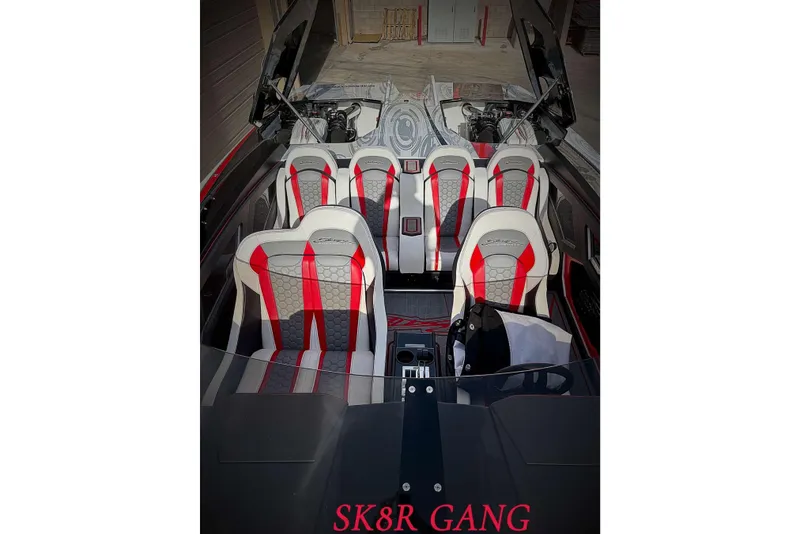 Slide: The Image of Interior of 2009 Skater 388 boat with red and white seats, labeled "SK8R GANG." - 17