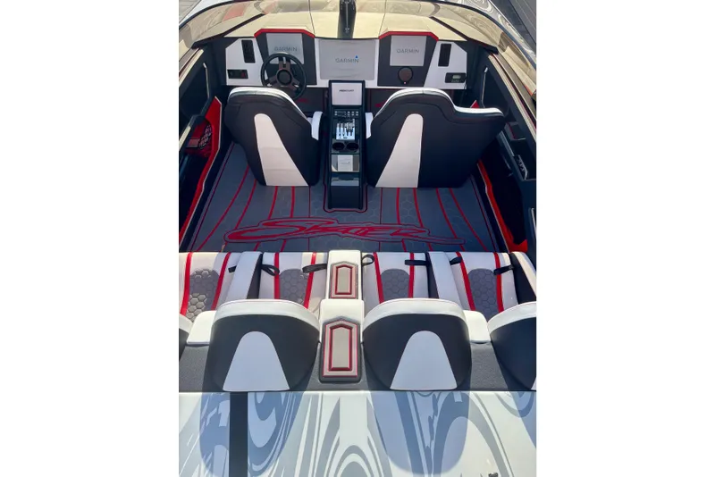 Slide: The Image of Interior of 2009 Skater 388 boat with modern seating and Garmin navigation system. - 18