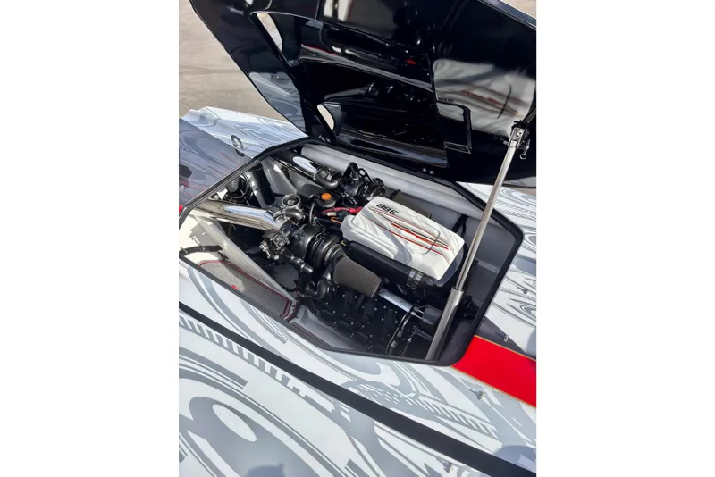 Slide: The Image of Open engine compartment of 2009 Skater 388 boat, showcasing detailed mechanical components. - 22