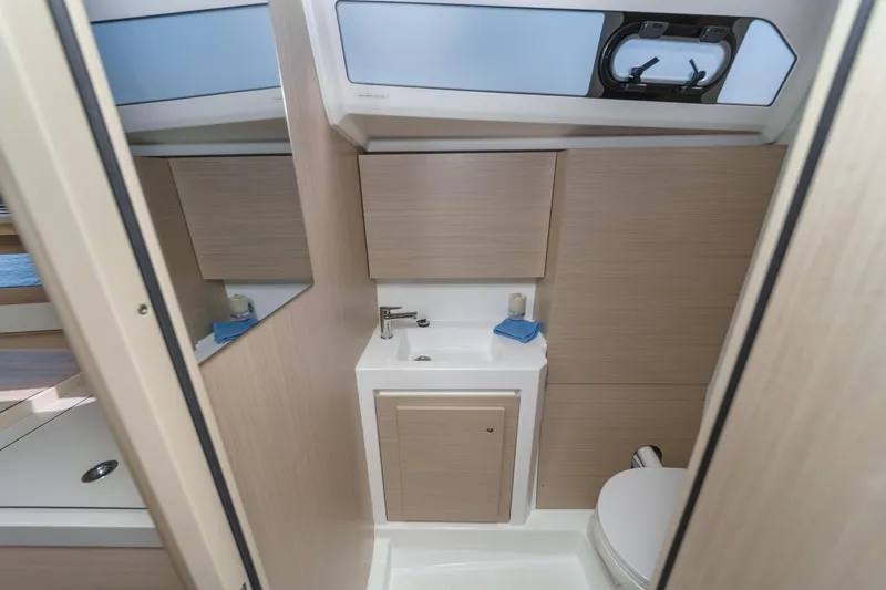 Slide: The Image of Modern bathroom interior of 2025 Beneteau Oceanis 37.1 yacht, featuring sleek design and compact amenities. - 22