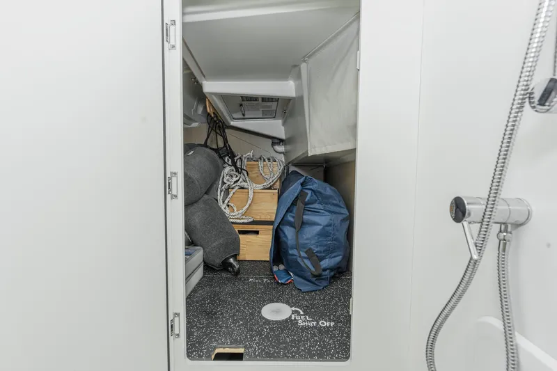 Slide: The Image of Storage area inside 2025 Beneteau Oceanis 37.1 yacht with ropes and gear. - 24