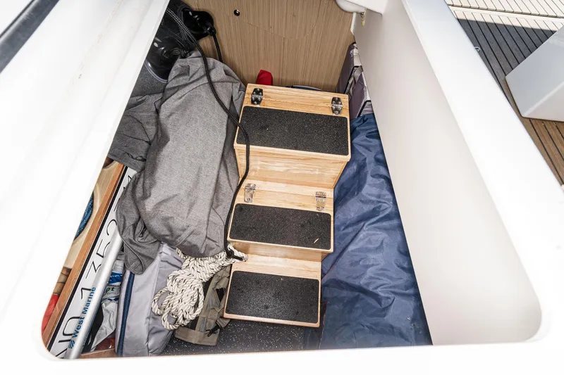 Slide: The Image of Storage compartment with wooden steps in 2025 Beneteau Oceanis 37.1 sailboat. - 27