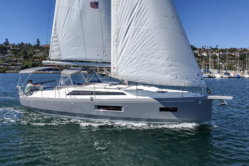 Slide: The Image of 2025 Beneteau Oceanis 37.1 sailing yacht on water, showcasing sleek design and white sails. - 32