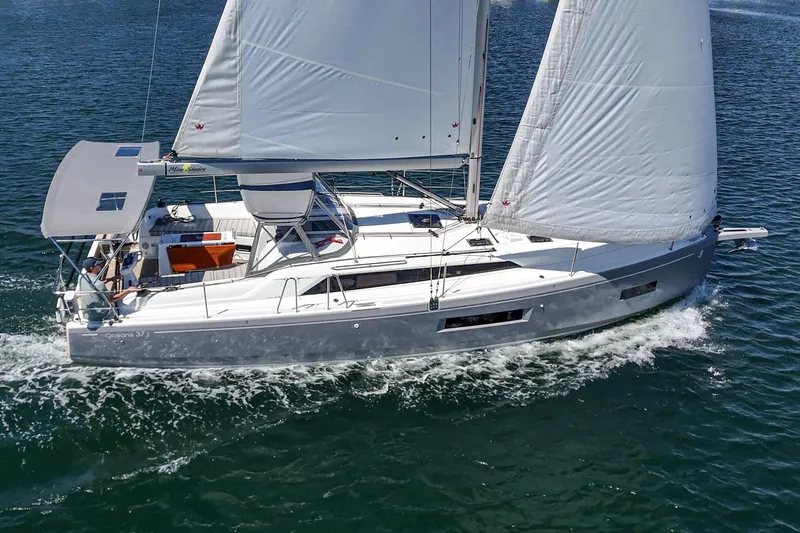 Slide: The Image of 2025 Beneteau Oceanis 37.1 sailing yacht cruising on open water. - 33