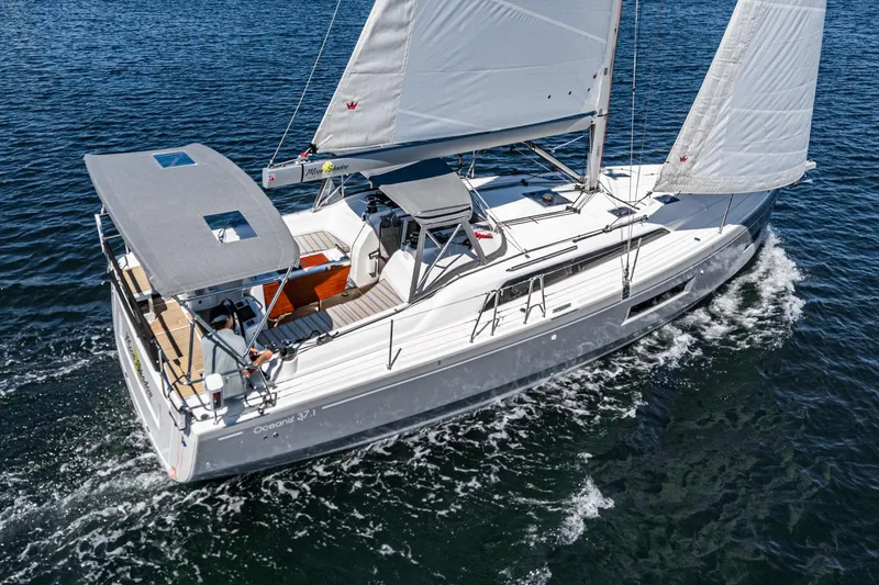 Slide: The Image of 2025 Beneteau Oceanis 37.1 sailing on open water, showcasing sleek design and modern features. - 34