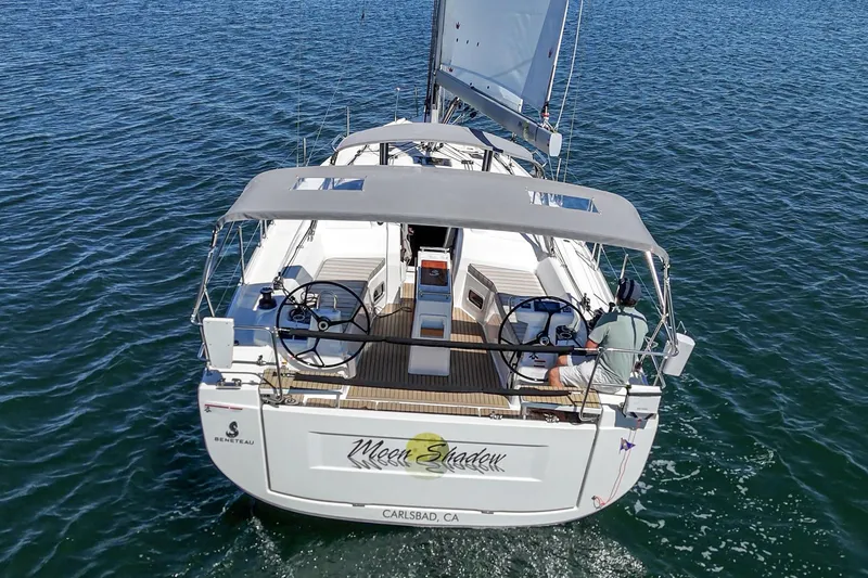 Slide: The Image of 2025 Beneteau Oceanis 37.1 sailboat cruising on open water, rear view. - 41