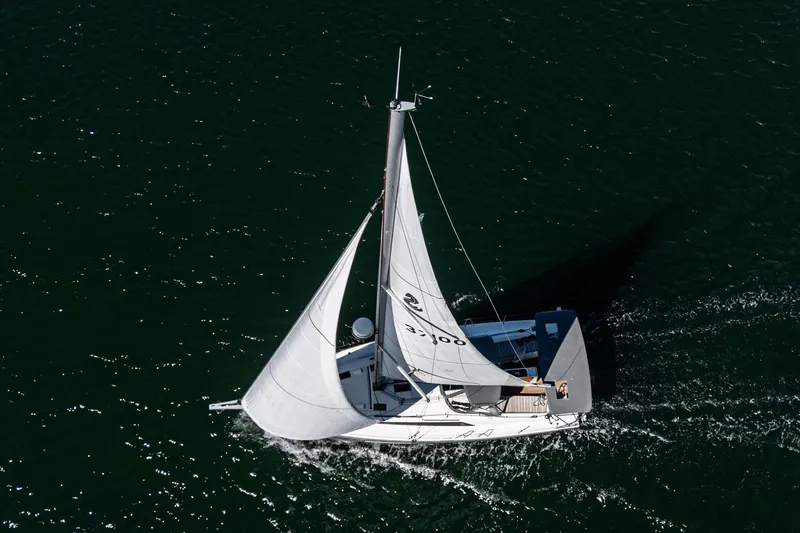 Slide: The Image of 2025 Beneteau Oceanis 37.1 sailing on open water, aerial view. - 44