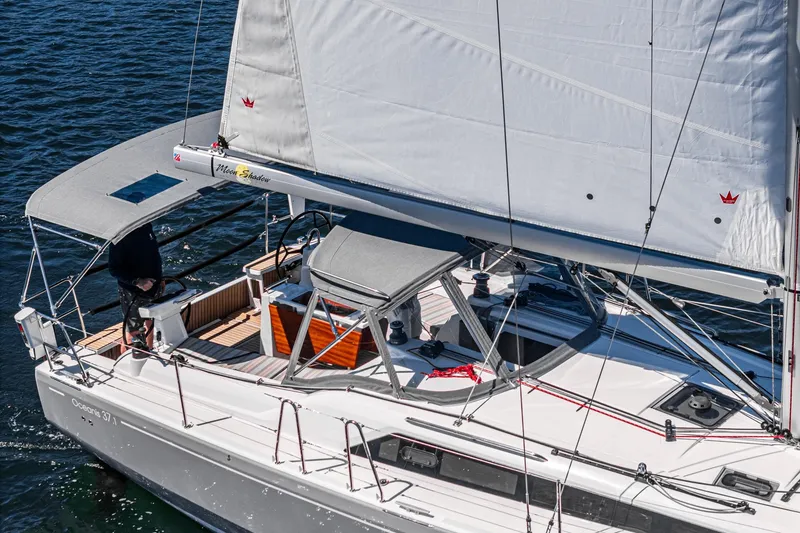 Slide: The Image of 2025 Beneteau Oceanis 37.1 sailboat cruising on open water, featuring sleek design and spacious deck. - 49