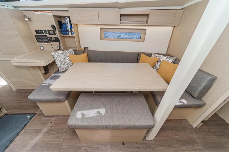 Slide: The Image of 2025 Beneteau Oceanis 37.1 interior with cozy dining area and modern design. - 6