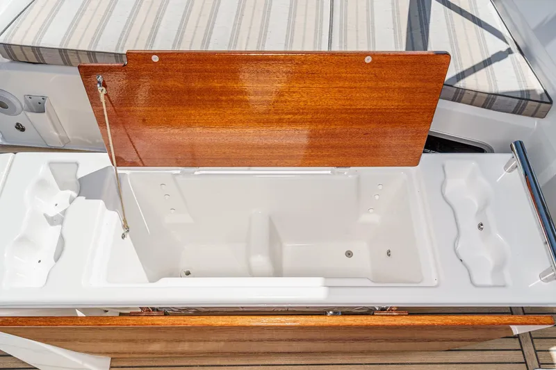 Slide: The Image of Beneteau Oceanis 37.1 (2025) yacht deck with open storage compartment. - 61