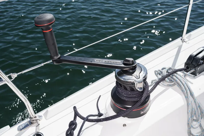 Slide: The Image of Winch handle on 2025 Beneteau Oceanis 37.1 sailboat, with ropes and ocean background. - 66
