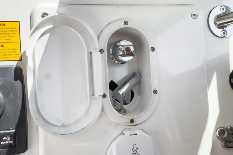 Slide: The Image of Control panel on a 2025 Beneteau Oceanis 37.1 sailboat, featuring a chrome handle. - 71