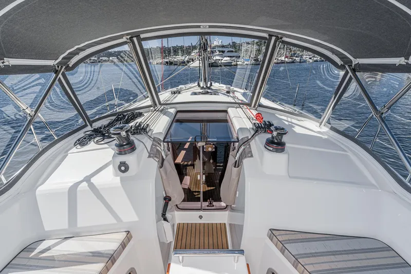 Slide: The Image of 2025 Beneteau Oceanis 37.1 yacht cockpit with modern design and marina view. - 77