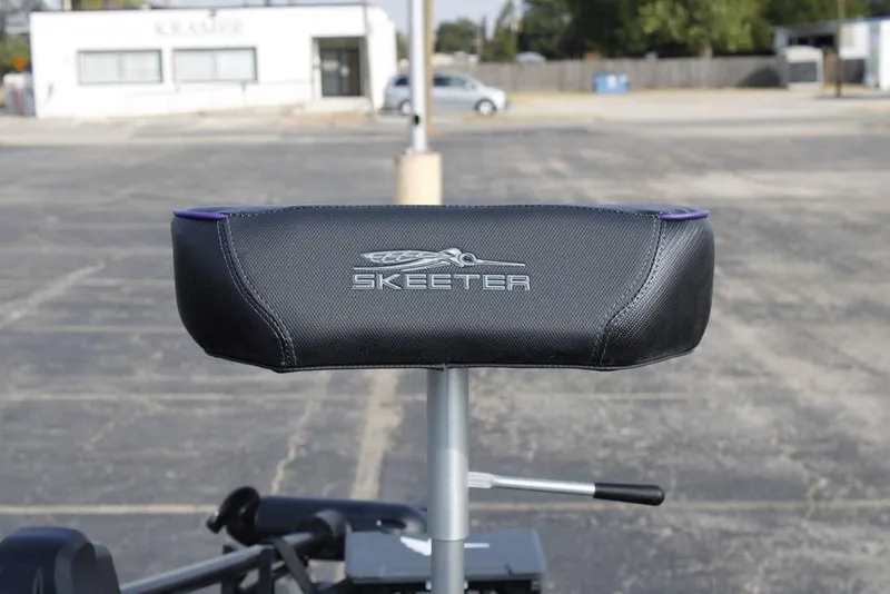 Slide: The Image of 2026 Skeeter ZXE21 boat seat with logo in a parking lot setting. - 12