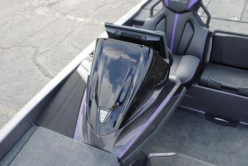 Slide: The Image of 2026 Skeeter ZXE21 boat interior with sleek black console and modern seating design. - 21