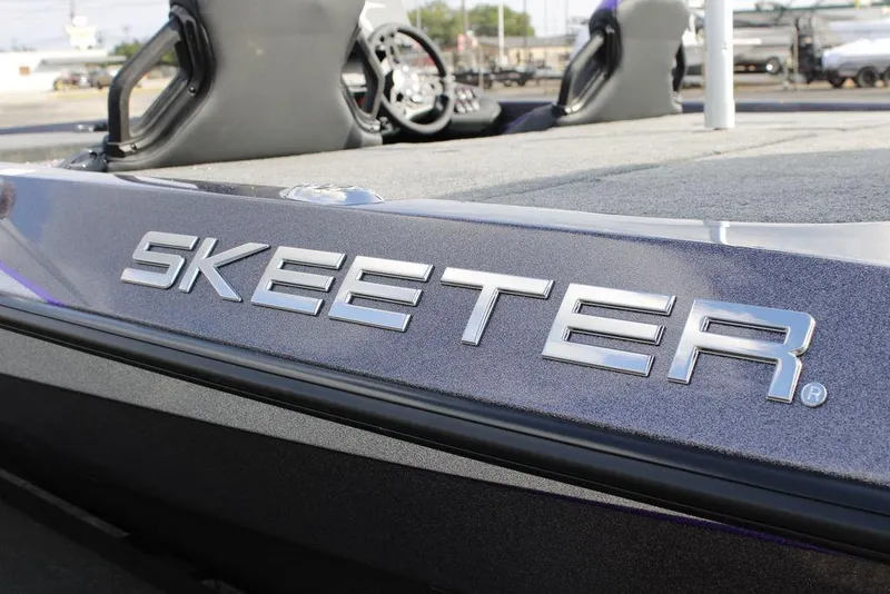 Slide: The Image of 2026 Skeeter ZXE21 boat with sleek metallic branding on the side. - 26