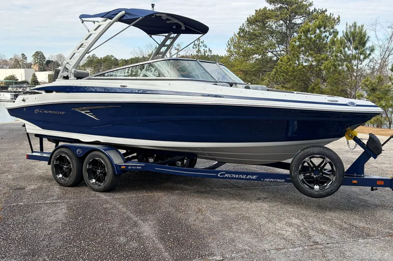 The Image of 2026 Crownline 240 SS boat on trailer outdoors. - 0