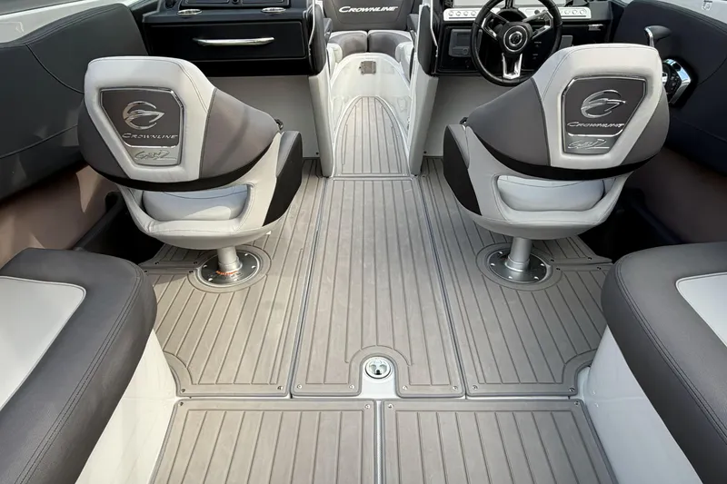 Slide: The Image of Interior of 2026 Crownline 240 SS boat with modern seating and steering wheel. - 10