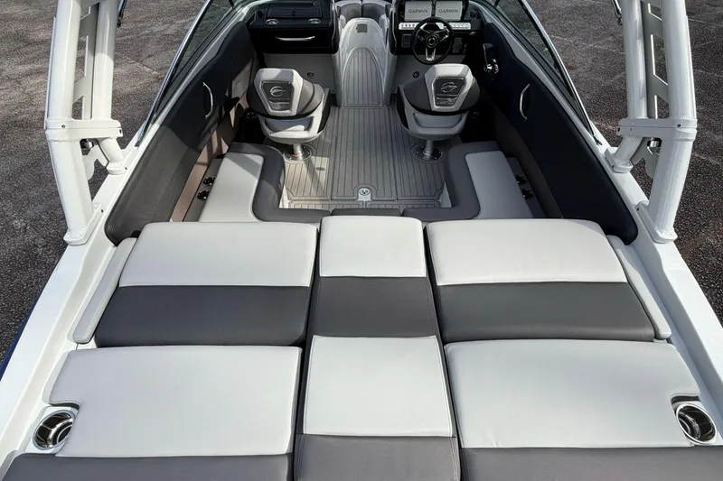 Slide: The Image of 2026 Crownline 240 SS boat interior with cushioned seating and modern dashboard. - 11