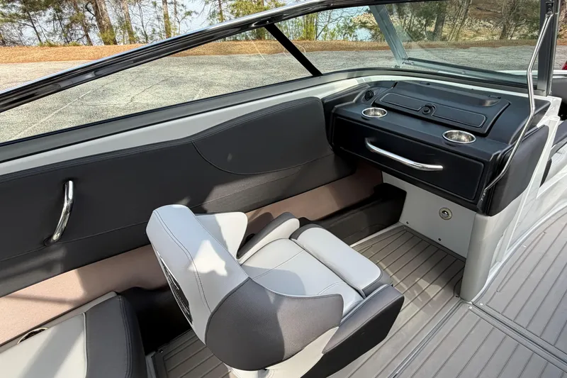Slide: The Image of 2026 Crownline 240 SS boat interior with sleek seating and modern dashboard design. - 6