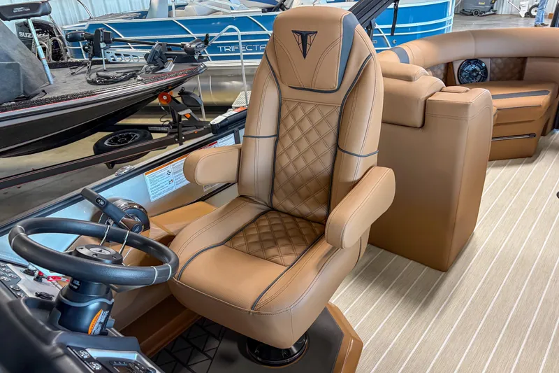 Slide: The Image of Luxurious interior of 2026 Trifecta 23 RF SS boat with tan leather seating. - 12