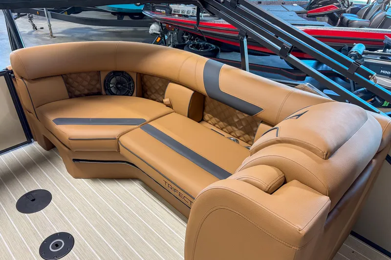 Slide: The Image of Luxurious seating in 2026 Trifecta 23 RF SS boat, featuring tan upholstery and modern design. - 13