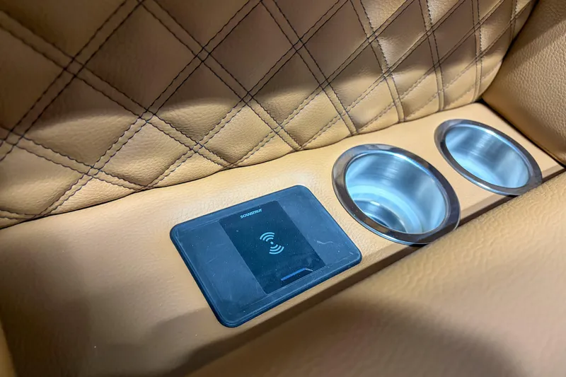 Slide: The Image of Luxurious leather interior of 2026 Trifecta 23 RF SS with wireless charging and cup holders. - 15
