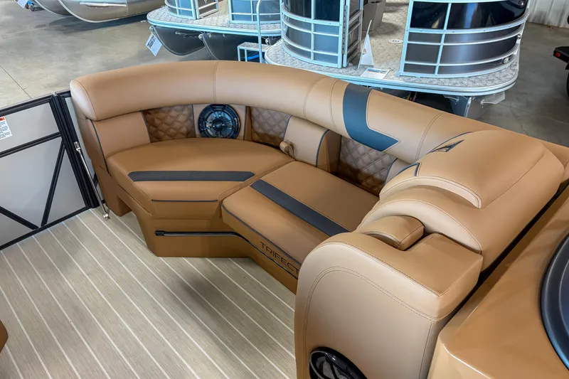 Slide: The Image of Luxurious interior of 2026 Trifecta 23 RF SS pontoon boat with tan leather seating. - 5