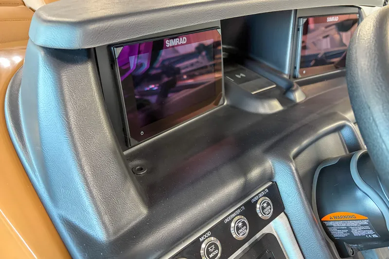 Slide: The Image of Dashboard of 2026 Trifecta 23 RF SS with Simrad displays and control buttons. - 8