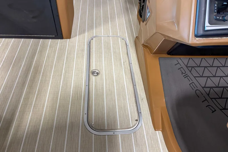 Slide: The Image of 2026 Trifecta 23 RF SS boat interior with sleek flooring and control panel. - 9