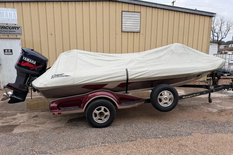Slide: The Image of 2008 Ranger 188 VX boat with Yamaha engine, covered and on a trailer. - 9