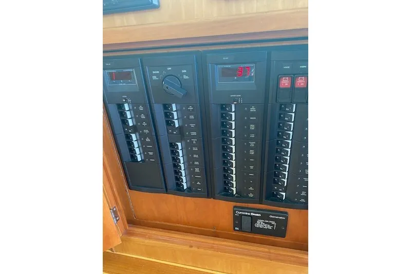 Slide: The Image of Electrical panel of 2010 Sabre 38 Express boat, featuring switches and digital display. - 11
