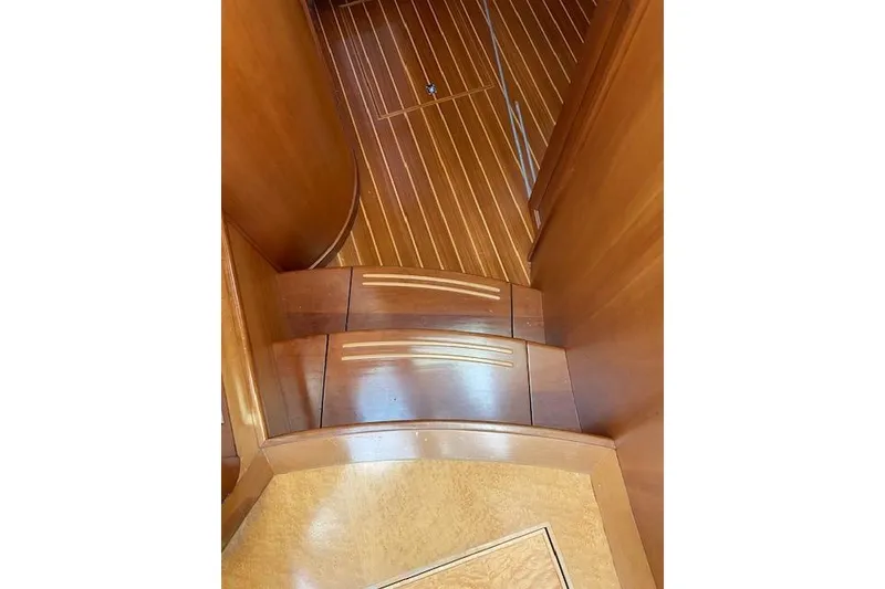 Slide: The Image of Wooden interior stairs of a 2010 Sabre 38 Express yacht. - 19
