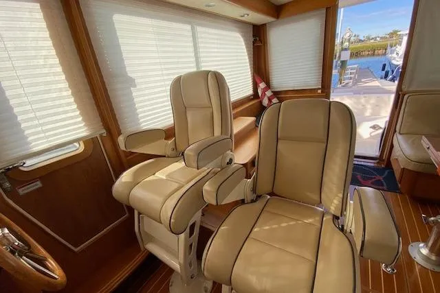 Slide: The Image of Interior of 2010 Sabre 38 Express yacht with beige leather seating and wooden accents. - 20