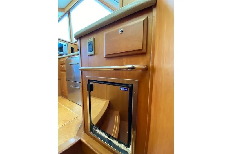 Slide: The Image of Interior of 2010 Sabre 38 Express yacht with wooden cabinetry and stainless steel appliances. - 31