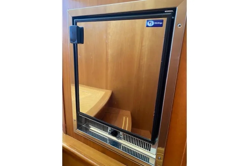 Slide: The Image of Built-in fridge on 2010 Sabre 38 Express yacht, featuring a sleek stainless steel design. - 34