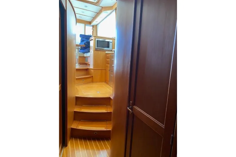 Slide: The Image of Interior of 2010 Sabre 38 Express yacht with wooden stairs and cabinetry. - 40