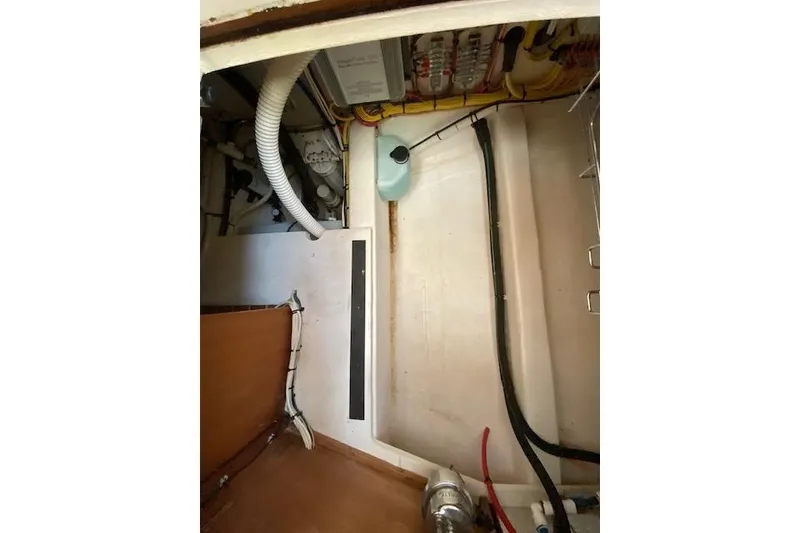 Slide: The Image of Engine compartment of a 2010 Sabre 38 Express boat, showing hoses and wiring. - 41