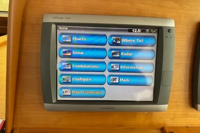 Slide: The Image of Garmin GPS display on 2010 Sabre 38 Express boat, showing navigation and sonar options. - 45