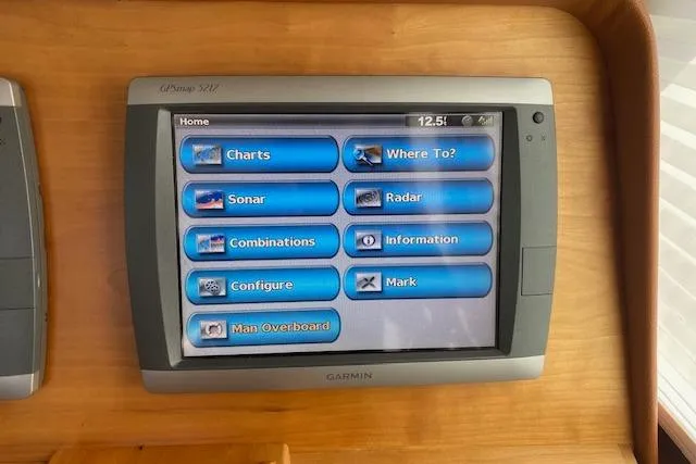 Slide: The Image of Garmin marine navigation display on 2010 Sabre 38 Express yacht dashboard. - 46