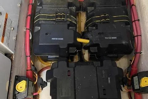 Slide: The Image of 2010 Sabre 40 Sedan battery compartment with wiring and secured battery boxes. - 49