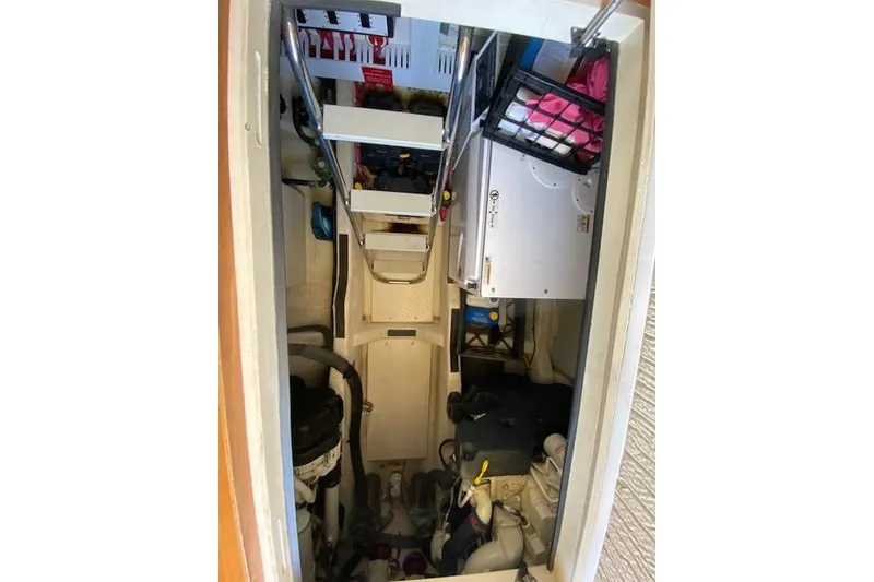 Slide: The Image of Engine room of 2010 Sabre 38 Express boat with equipment and storage. - 5
