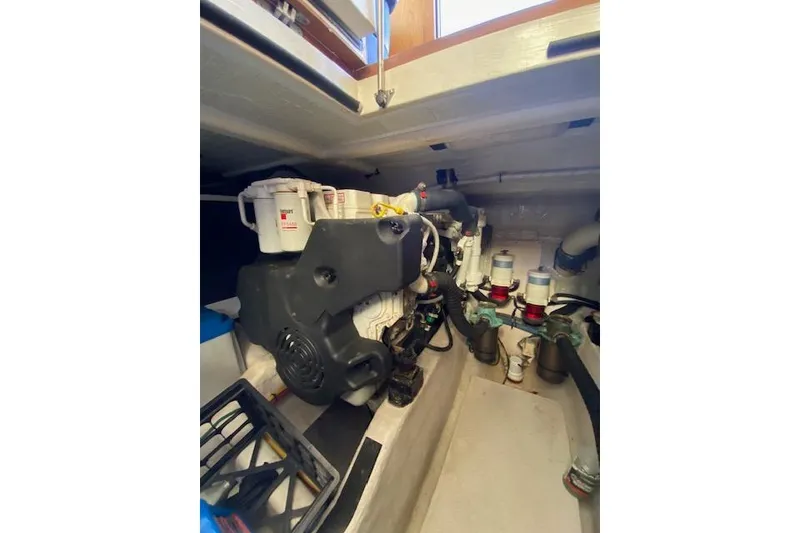 Slide: The Image of Engine room of a 2010 Sabre 40 Sedan yacht, showcasing mechanical components. - 50