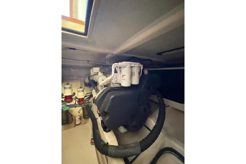 Slide: The Image of Engine room of a 2010 Sabre 40 Sedan yacht, showcasing mechanical components. - 51