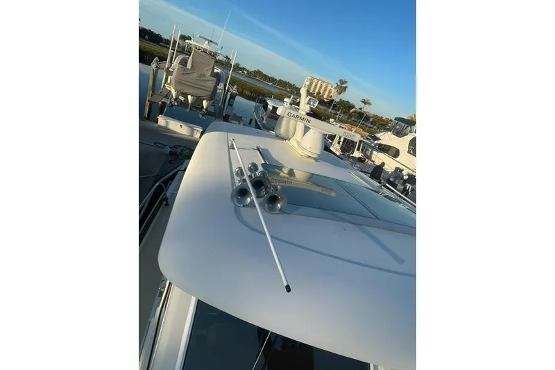 Slide: The Image of 2010 Sabre 40 Sedan yacht with Garmin equipment, docked under clear blue sky. - 61