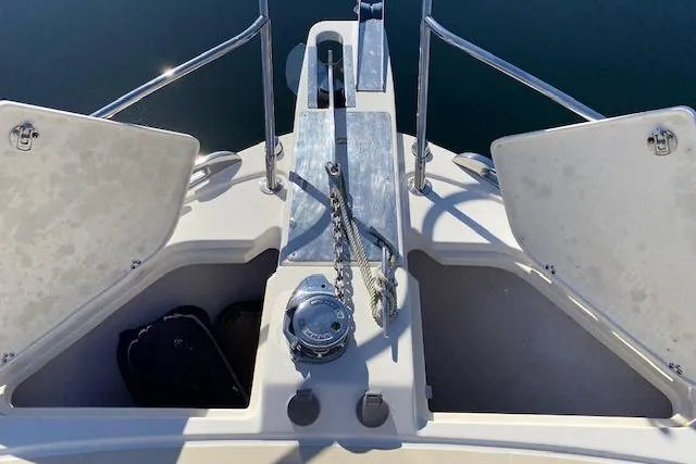 Slide: The Image of Bow of 2010 Sabre 40 Sedan with anchor and open storage compartments. - 67