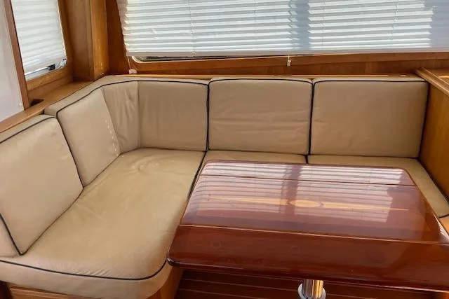 Slide: The Image of Luxurious interior of 2010 Sabre 40 Sedan with beige seating and wooden table. - 74