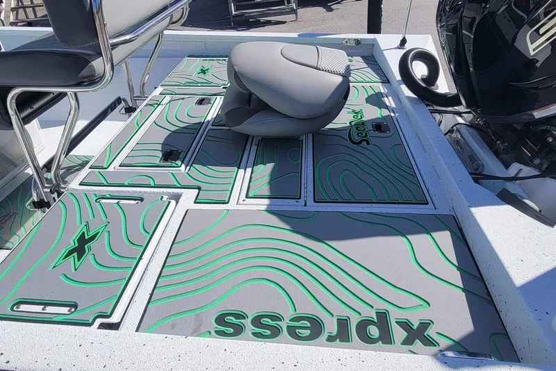 Slide: The Image of 2024 Xpress H22B Bay boat deck with custom green and gray design. - 12