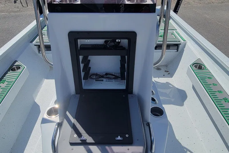 Slide: The Image of 2024 Xpress H22B Bay boat interior with storage compartment and measuring guides. - 15